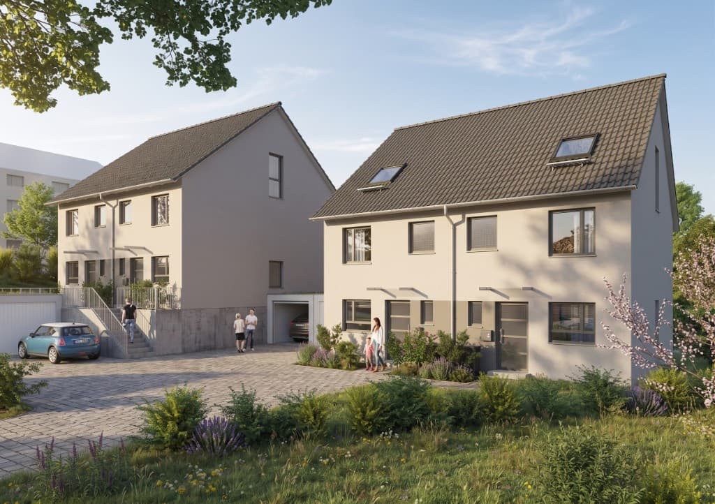 Außenansicht der modernen Doppelhaushälfte mit Garten und Terrasse